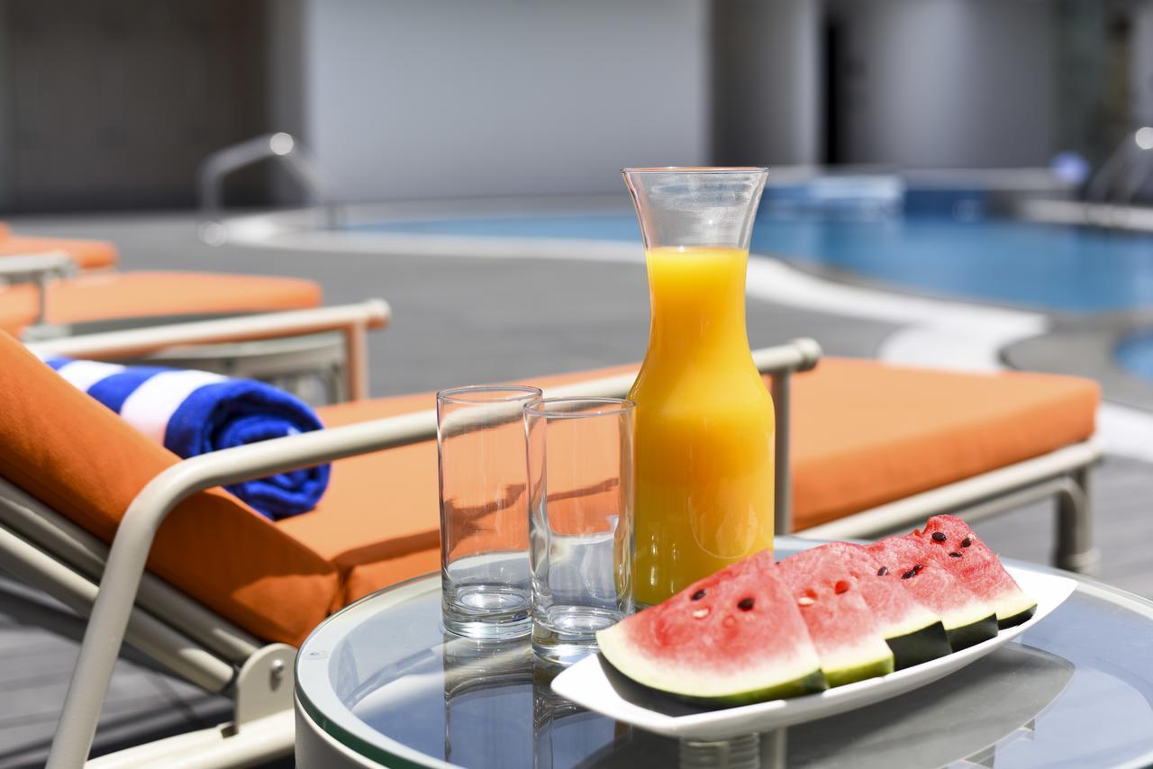 Fraser Suites Maszkat Kültér fotó A bottle of orange juice
